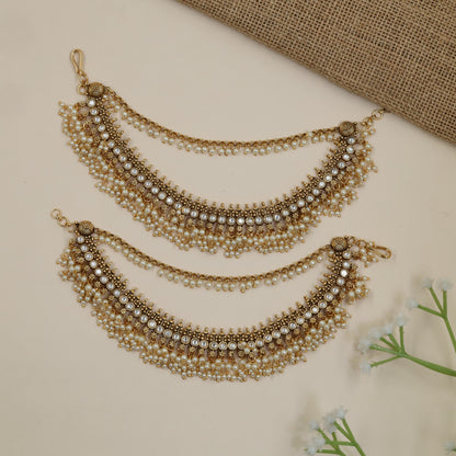 Antique Mati Featuring Intricate Round Accents and Hanging Beads