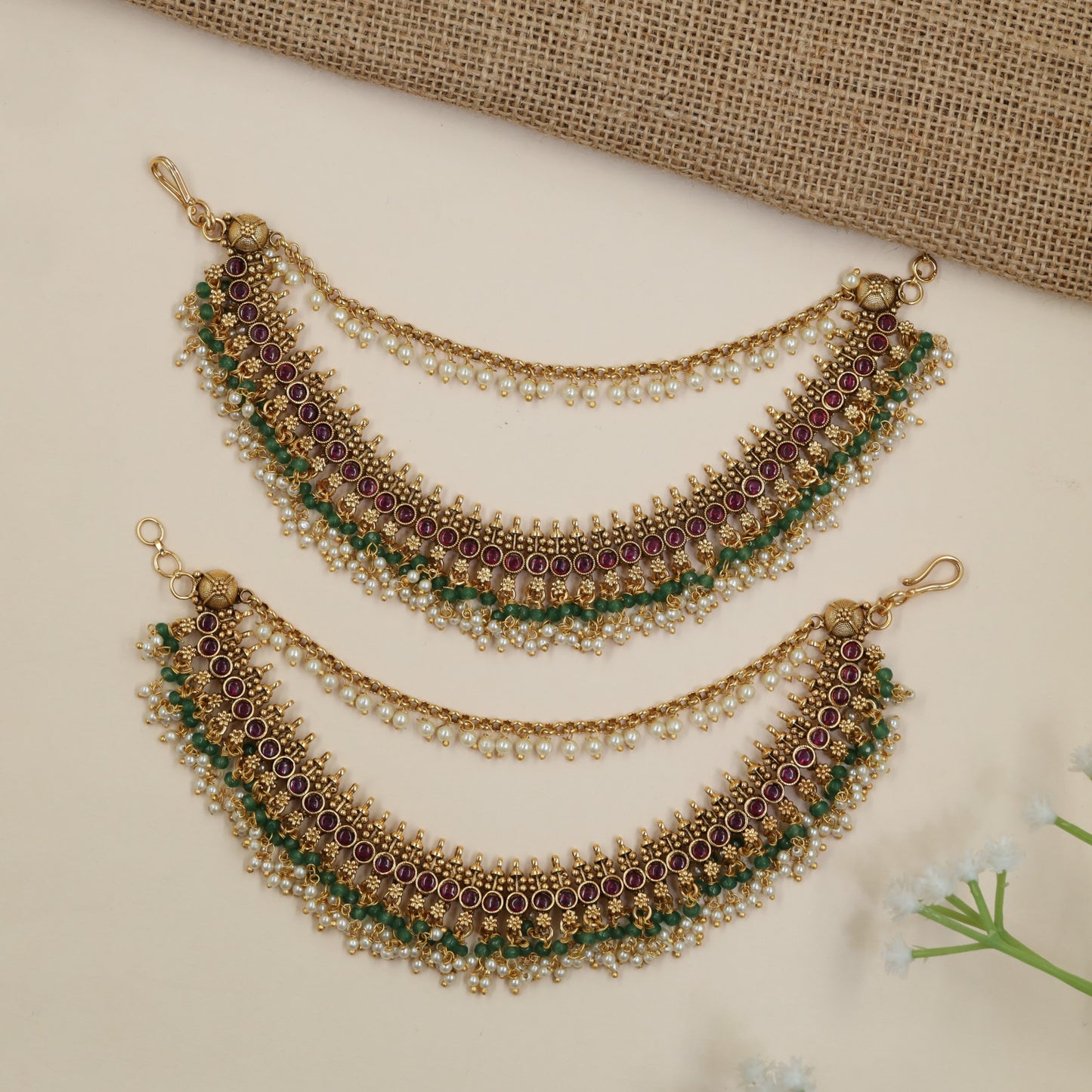 Antique Mati Featuring Intricate Round Accents and Hanging Beads