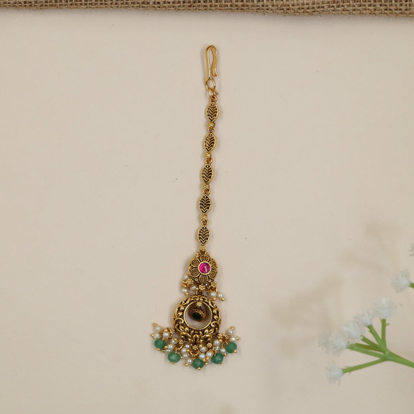 Antique Tikka Featuring Ornate Scrollwork and Beaded Drops