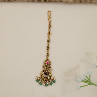 Antique Tikka Featuring Ornate Scrollwork and Beaded Drops