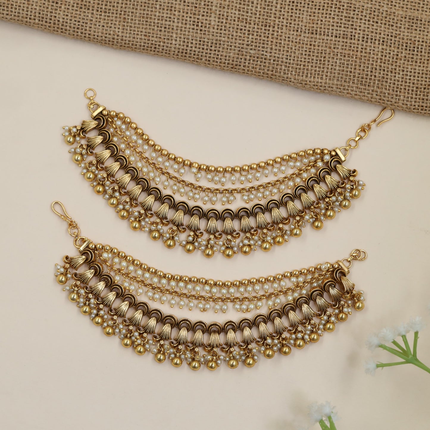 Antique Mati Featuring Curved Chains and Fan-Shaped Elements