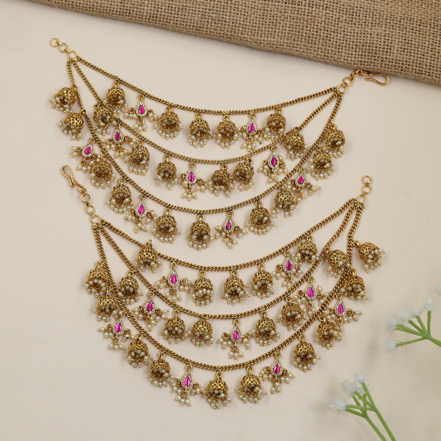 Antique Mati Featuring Curved Chains and Ornamental Pendants