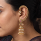 Intricate Floral Hoop Paired with Teardrop Studs in This Antique Cuff-Jumka