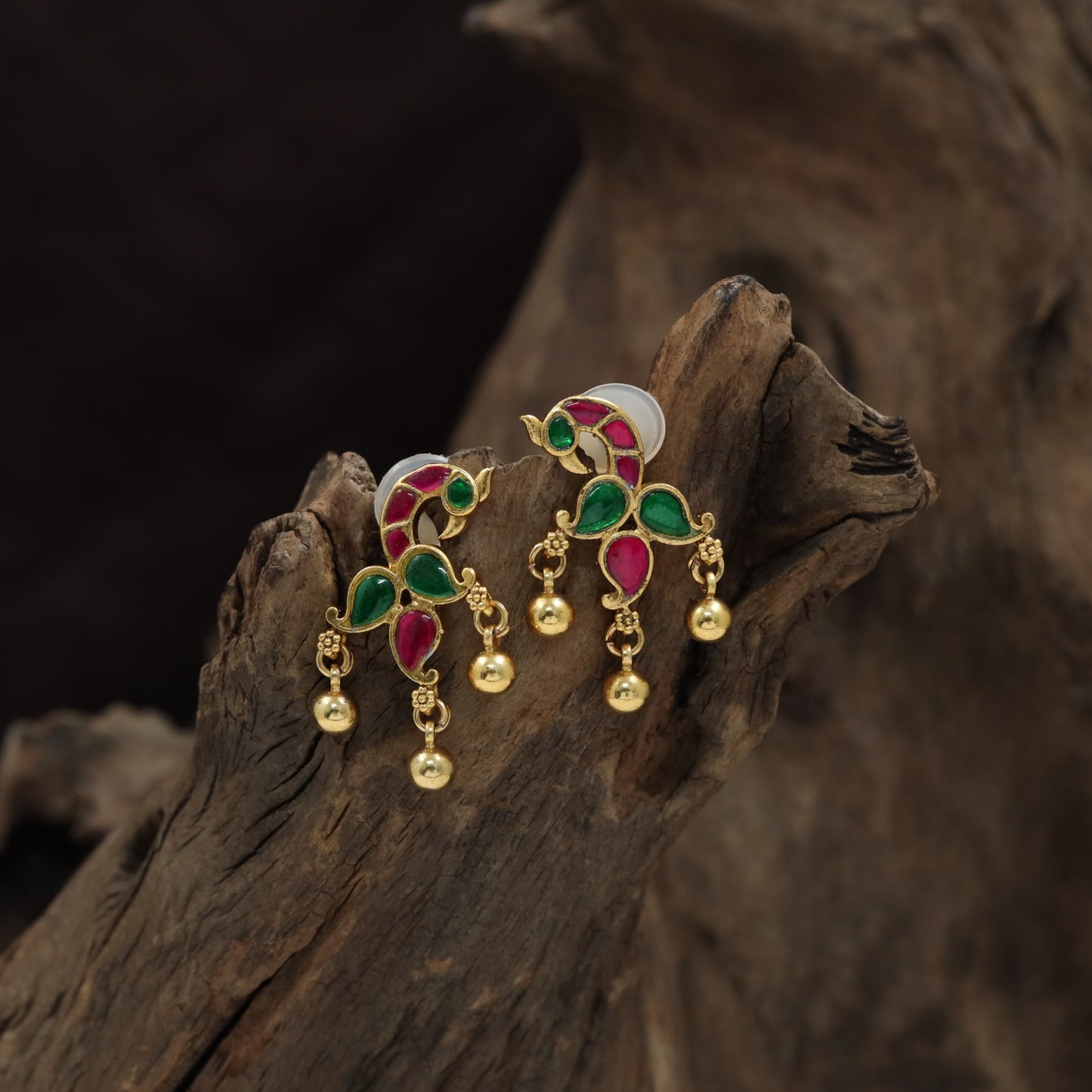 Peacock Antique Stud Showcasing Curved Decorative Elements
