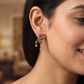 Peacock Antique Stud Showcasing Curved Decorative Elements