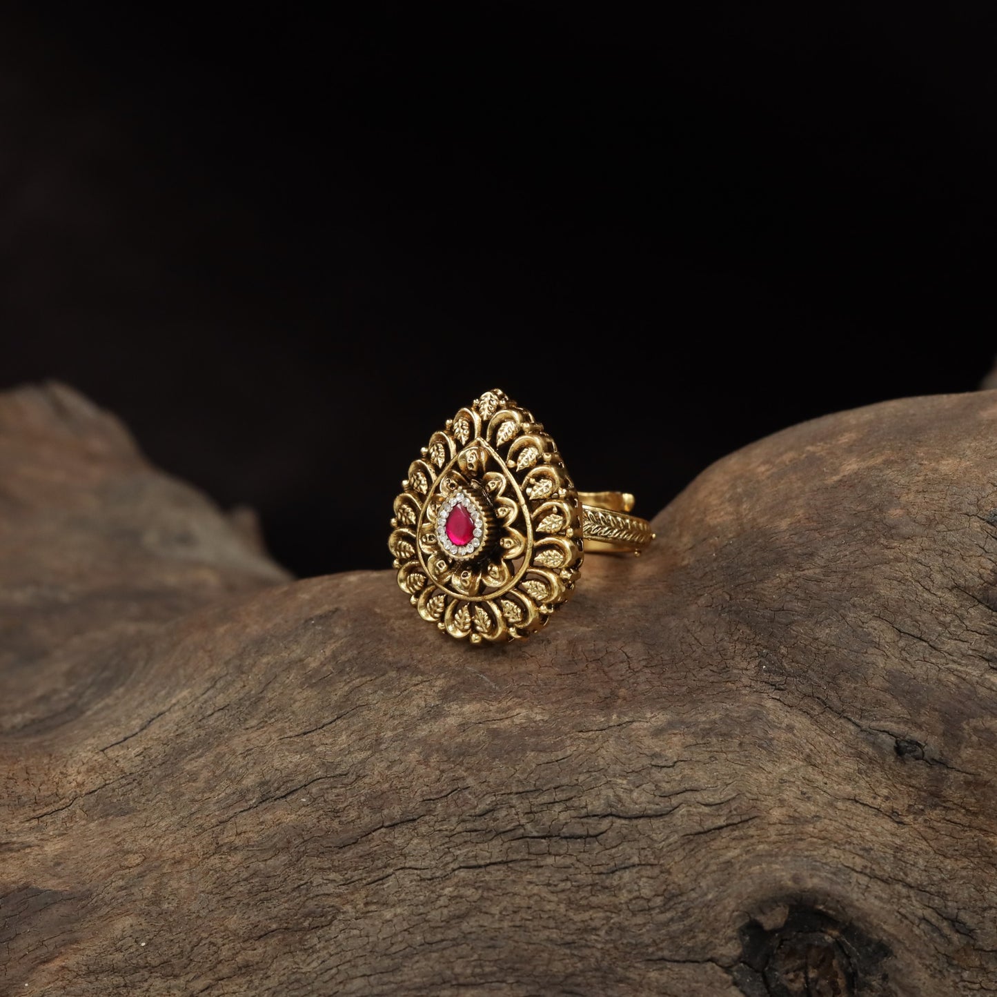 Curved Floral Work and Defined Teardrop Framing Antique Finger Ring