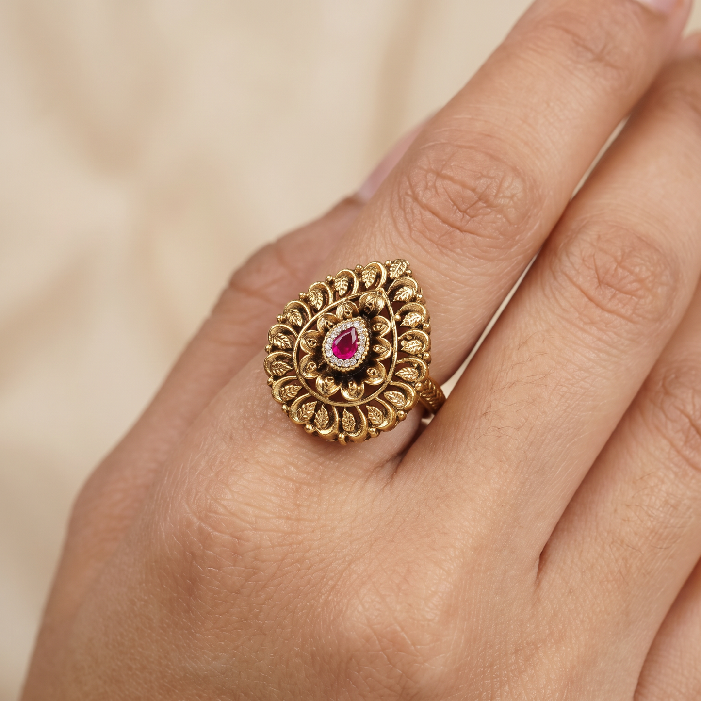 Curved Floral Work and Defined Teardrop Framing Antique Finger Ring