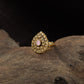Curved Floral Work and Defined Teardrop Framing Antique Finger Ring