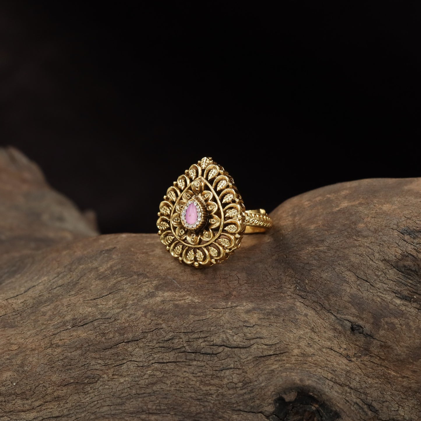 Curved Floral Work and Defined Teardrop Framing Antique Finger Ring
