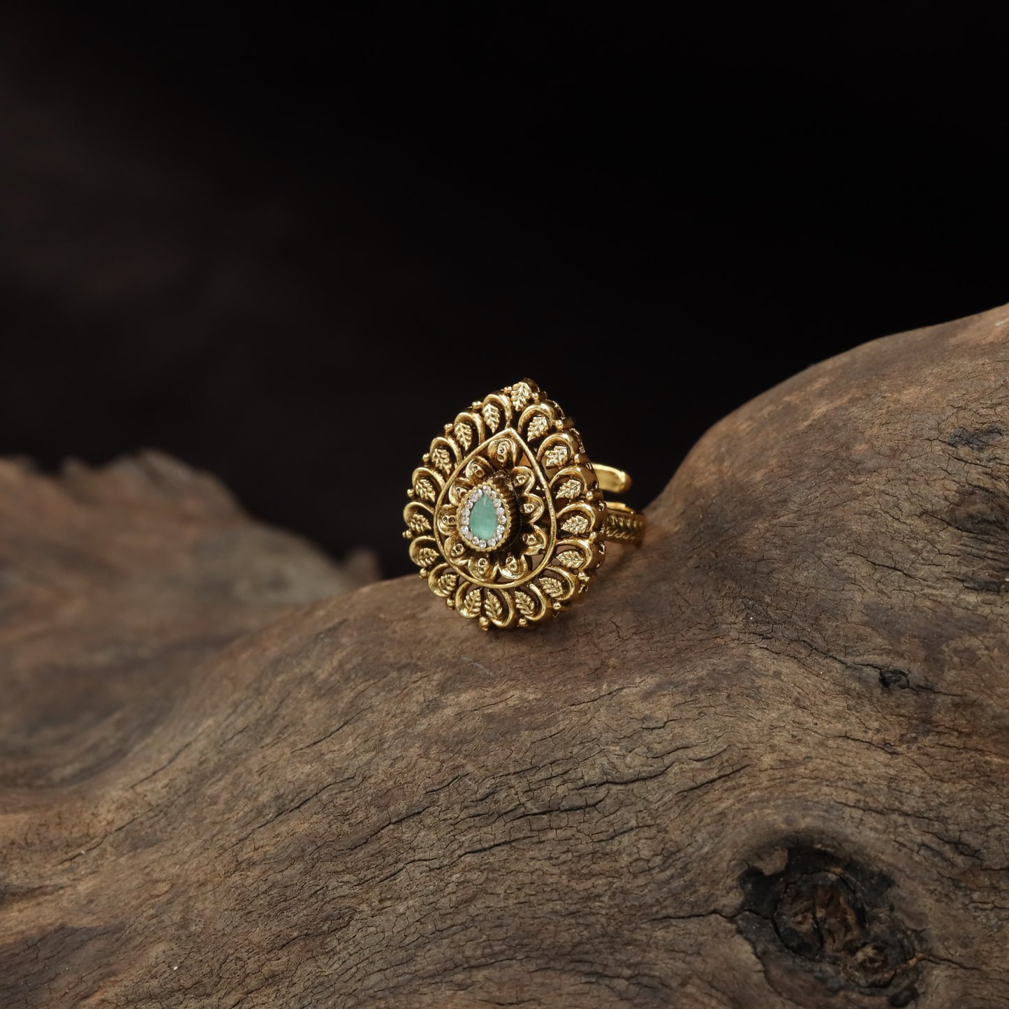 Curved Floral Work and Defined Teardrop Framing Antique Finger Ring