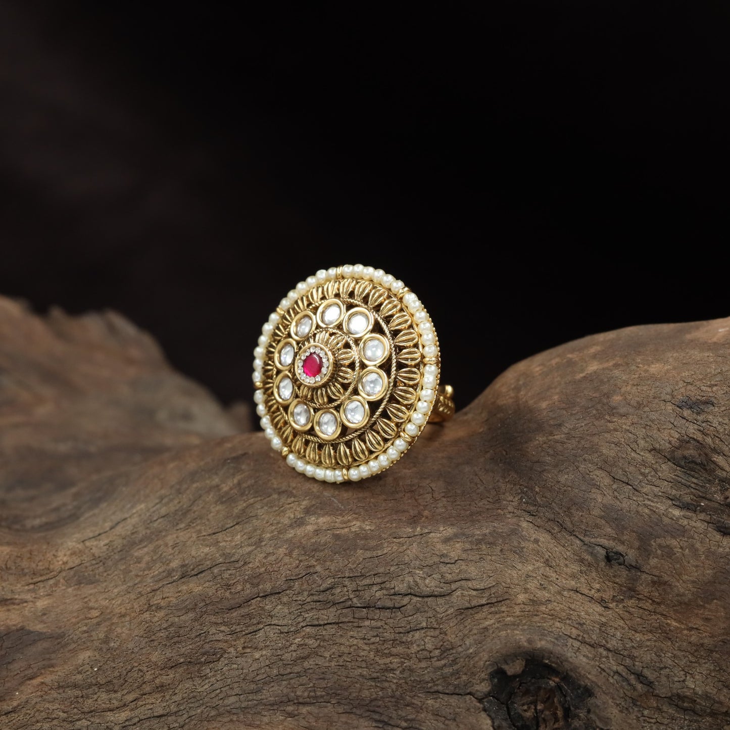 Traditional Antique Finger Ring with Sculpted Curves and Decorative Round Elements
