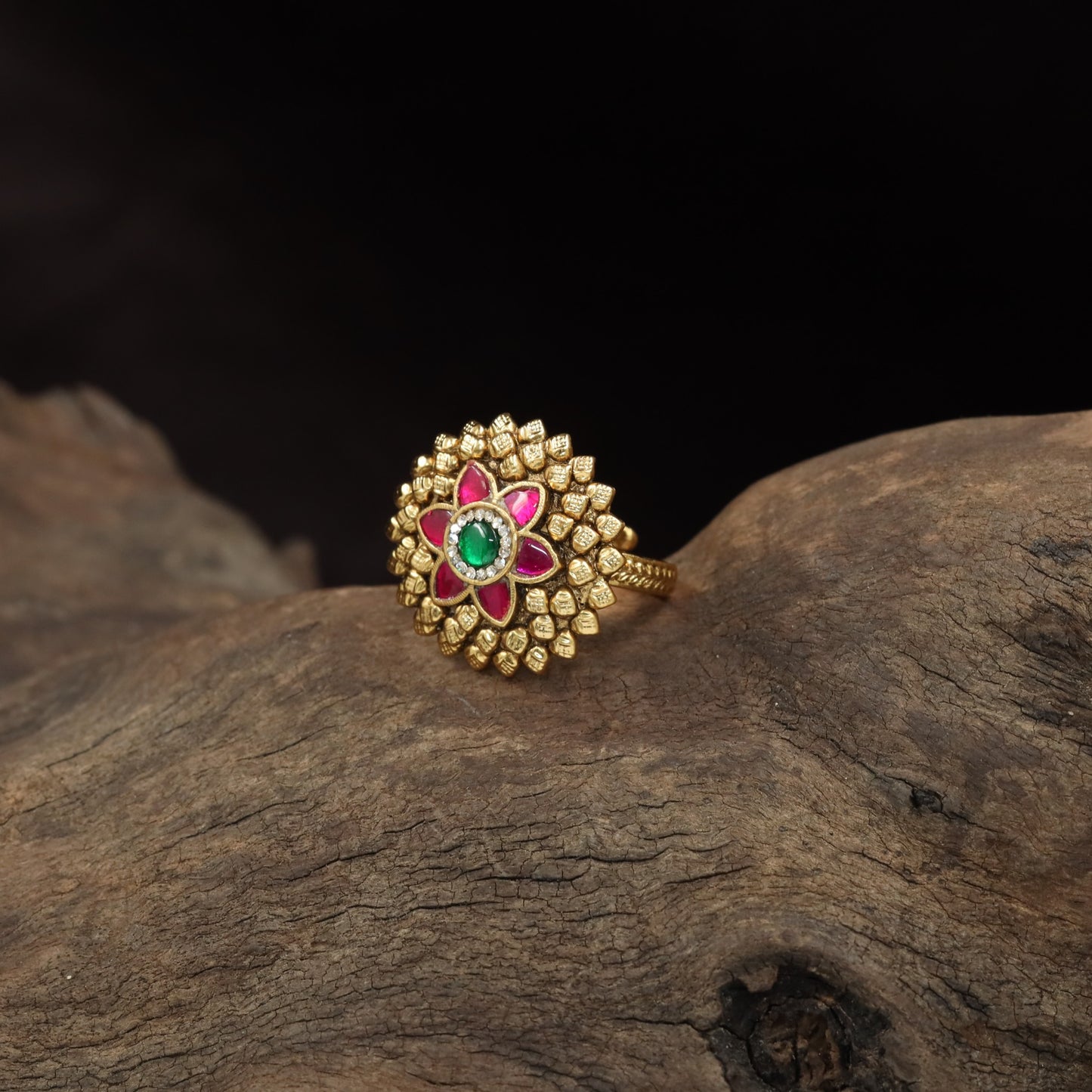 Antique Finger Ring Featuring a Symmetrical Flower Centre and Textured Petal Frame