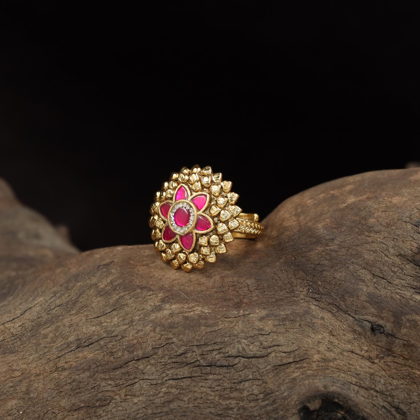 Antique Finger Ring Featuring a Symmetrical Flower Centre and Textured Petal Frame