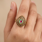 Antique Finger Ring Showcasing Intricate Floral Curves and Detailed Teardrop Framing