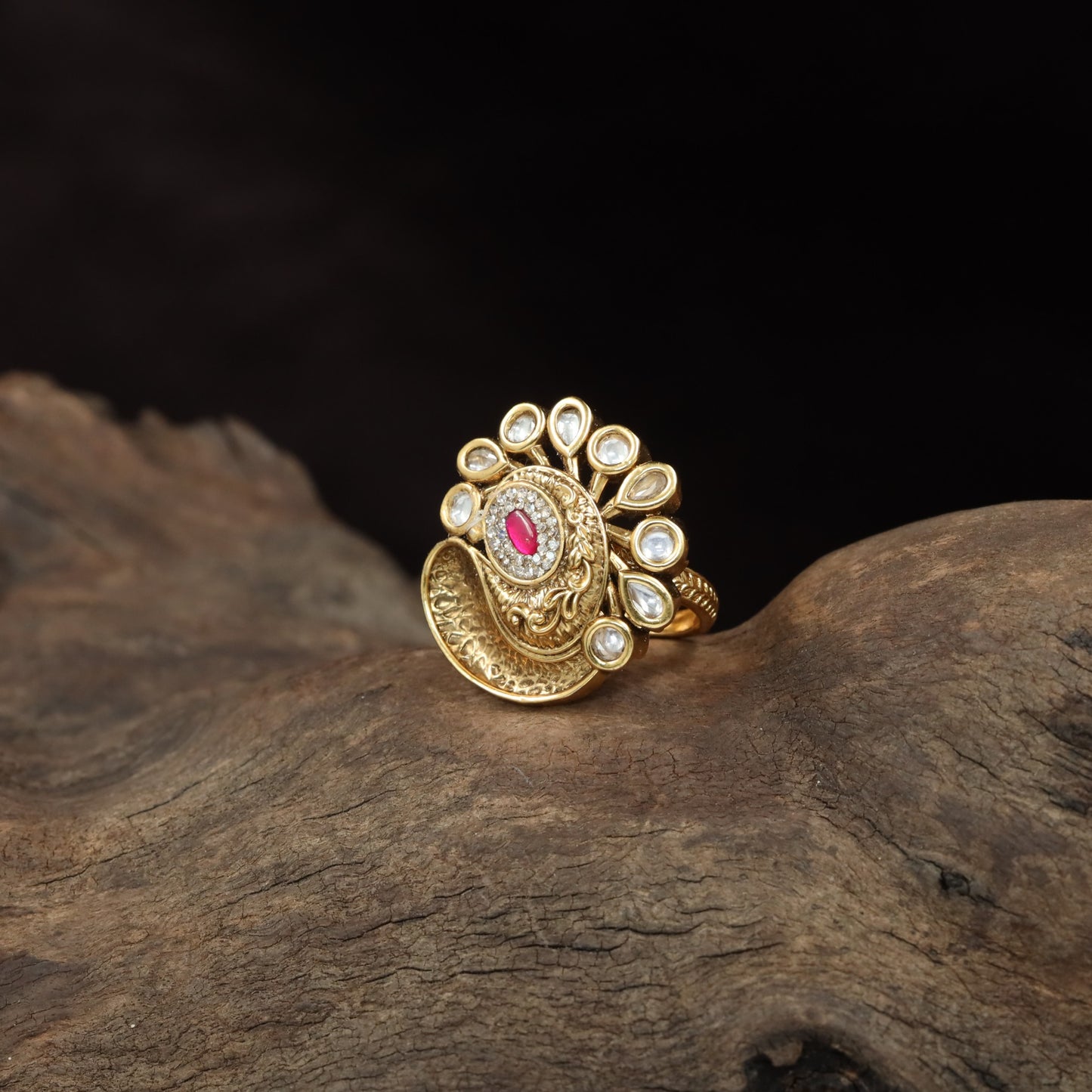 Antique Finger Ring with Teardrop Framing and Detailed Circular Medallion Work