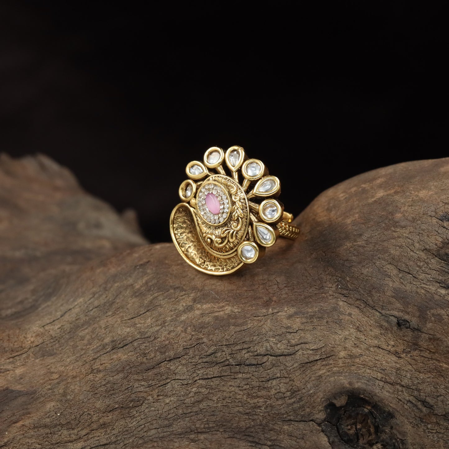 Antique Finger Ring with Teardrop Framing and Detailed Circular Medallion Work