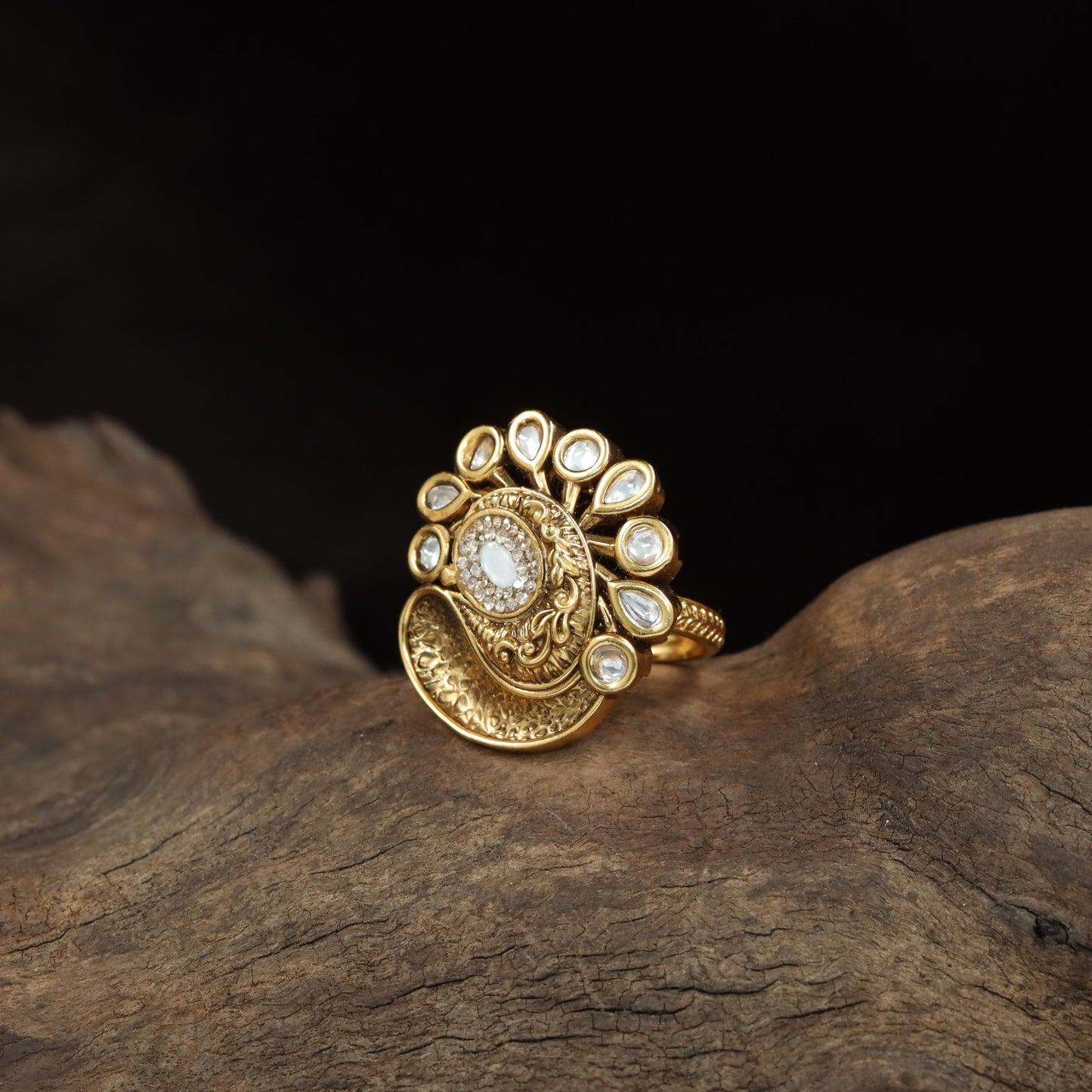 Antique Finger Ring with Teardrop Framing and Detailed Circular Medallion Work