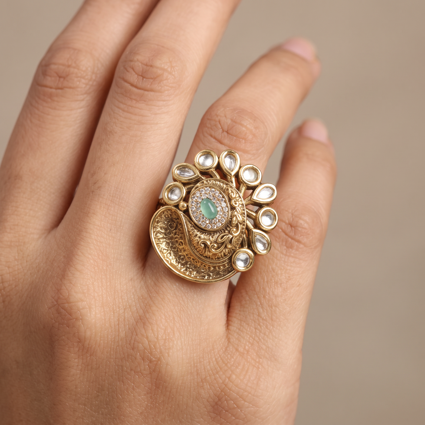 Antique Finger Ring with Teardrop Framing and Detailed Circular Medallion Work
