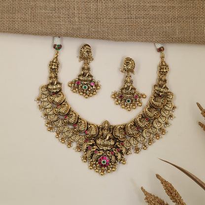 Antique Necklace with Detailed Lakshmi Centre and Decorative Hanging Elements