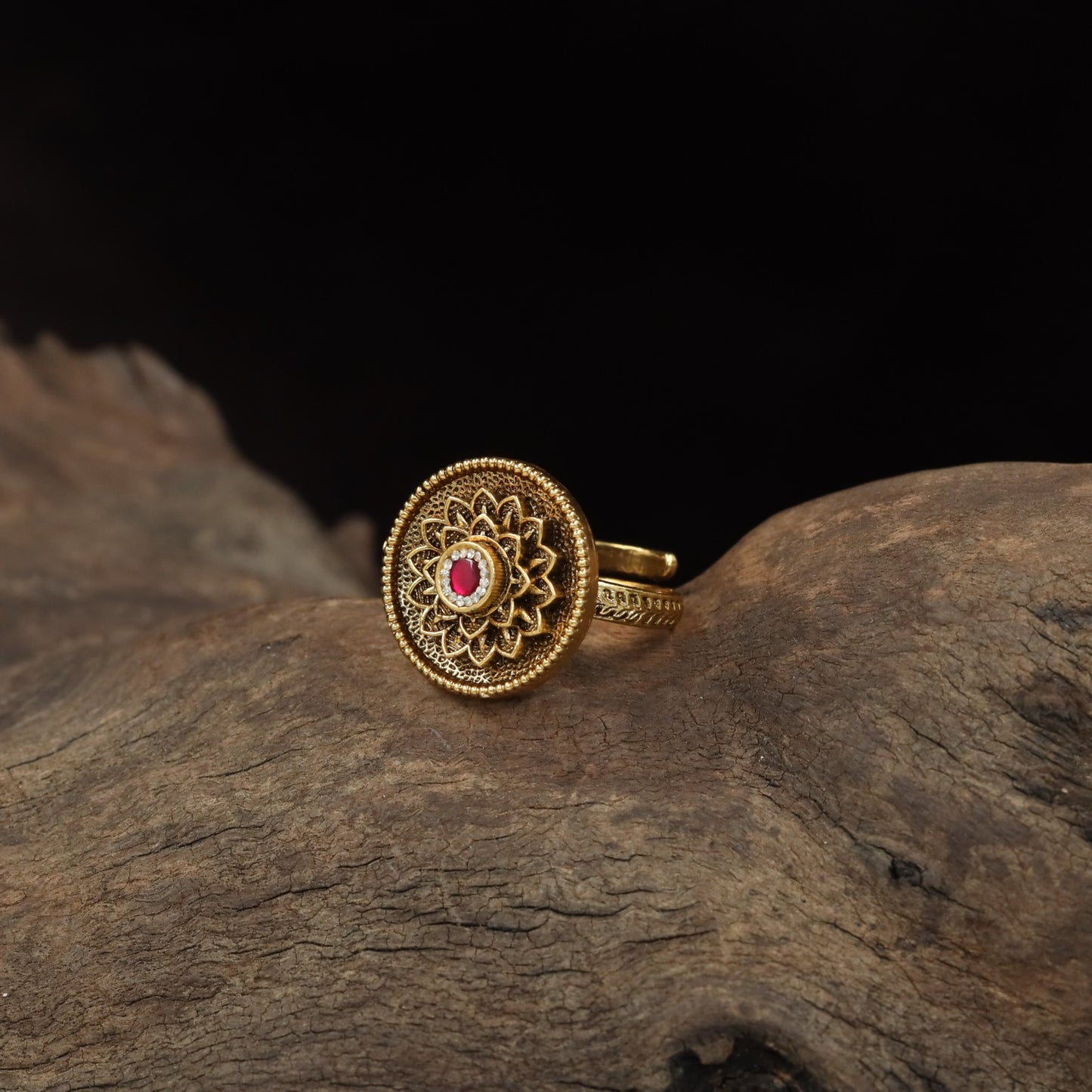 Antique Finger Ring with Detailed Rosette Centre and Textured Outer Frame