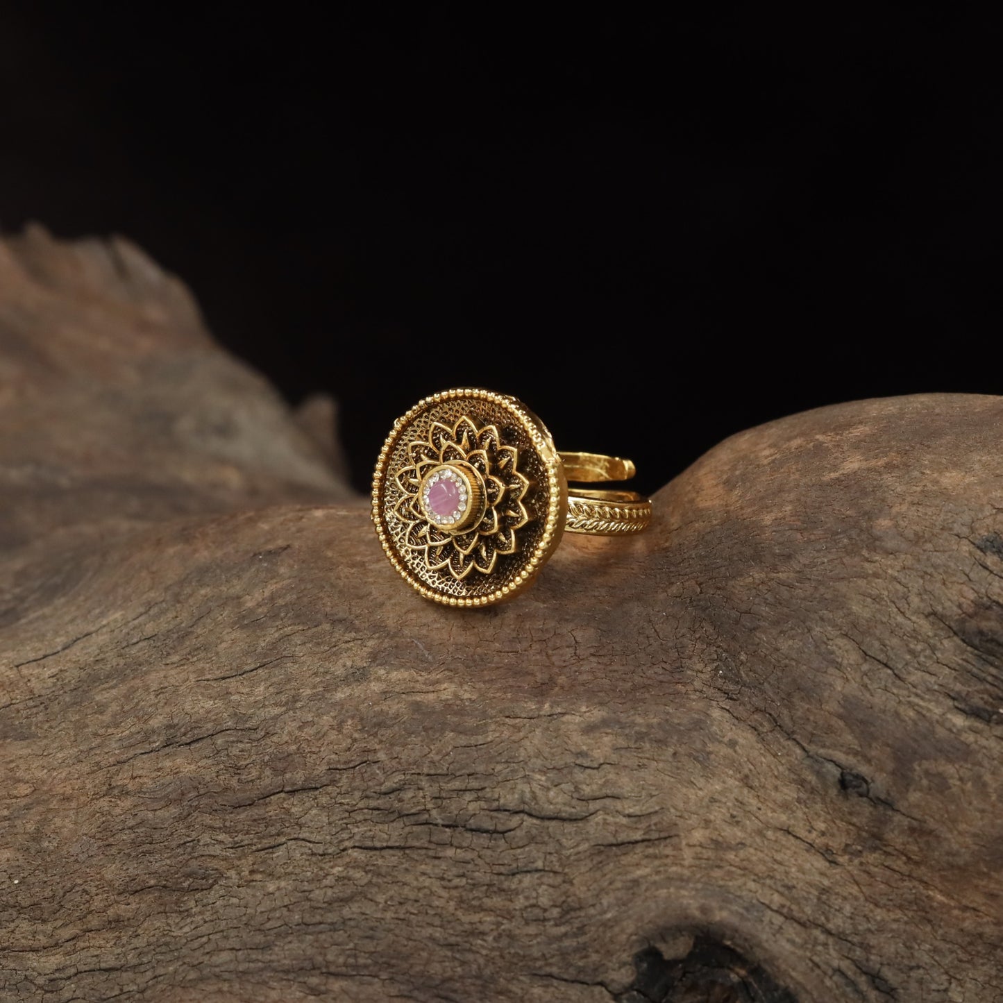 Antique Finger Ring with Detailed Rosette Centre and Textured Outer Frame
