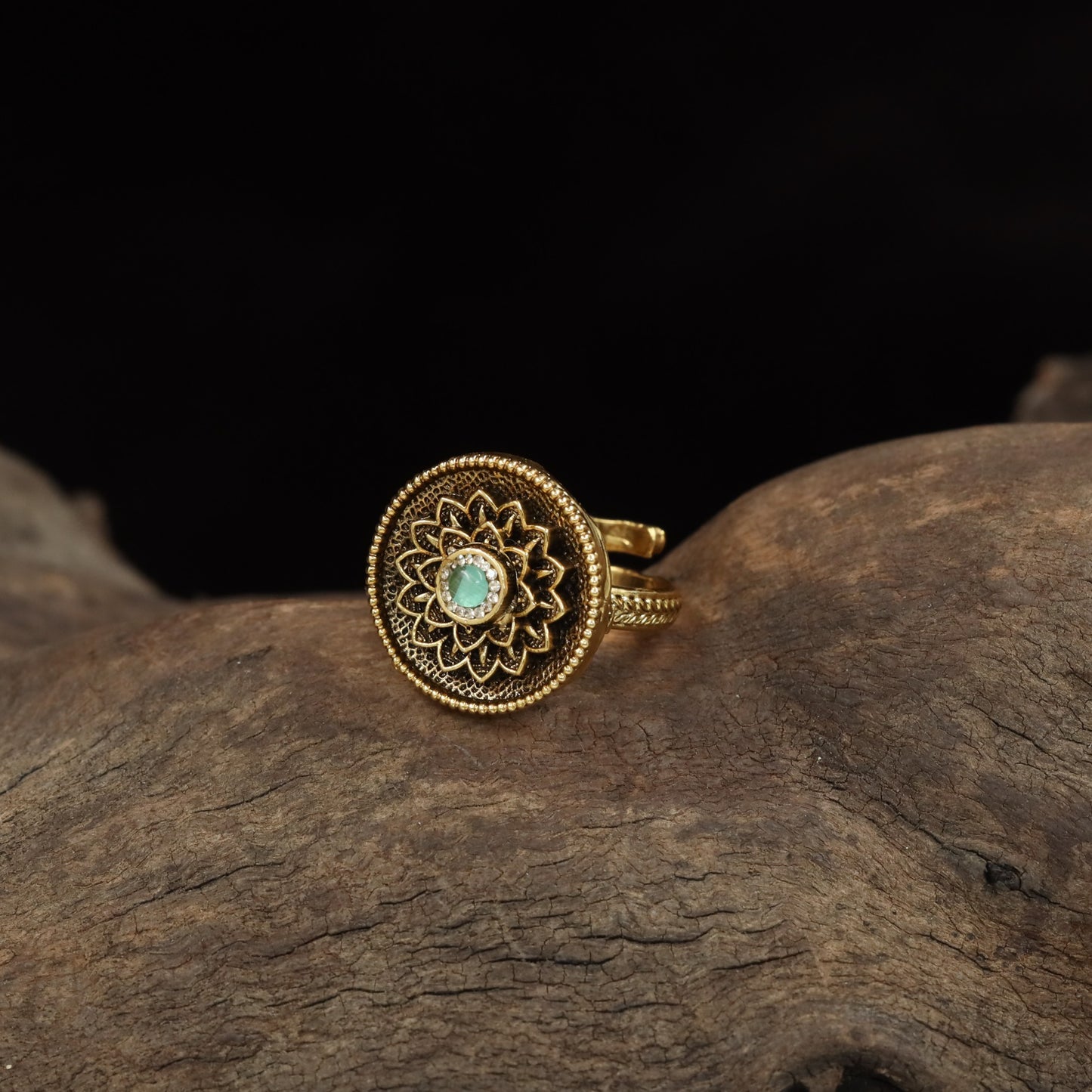 Antique Finger Ring with Detailed Rosette Centre and Textured Outer Frame