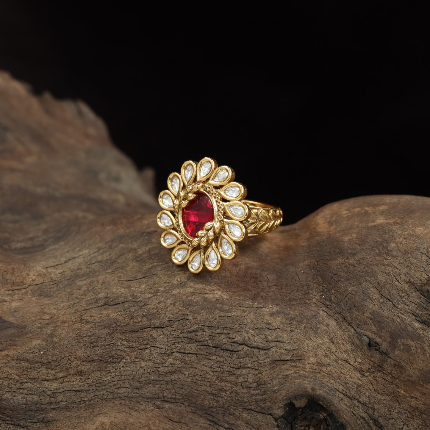 Antique Finger Ring with Symmetrical Petal Arrangement and Textured Band