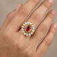 Antique Finger Ring with Symmetrical Petal Arrangement and Textured Band