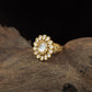 Antique Finger Ring with Symmetrical Petal Arrangement and Textured Band
