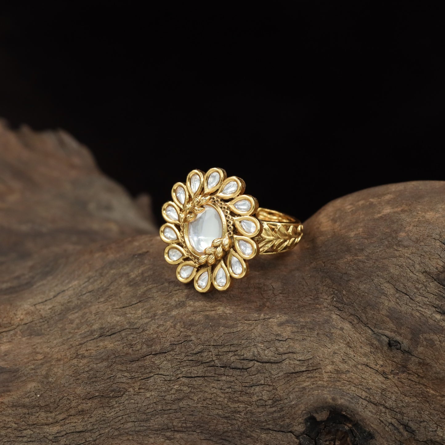 Antique Finger Ring with Symmetrical Petal Arrangement and Textured Band