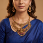 Antique Necklace with Detailed Lakshmi Pendant and Repeating Peacock Motifs
