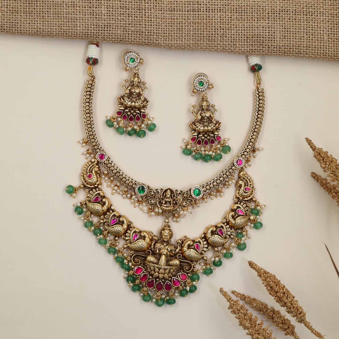 Antique Necklace with Detailed Lakshmi Pendant and Repeating Peacock Motifs