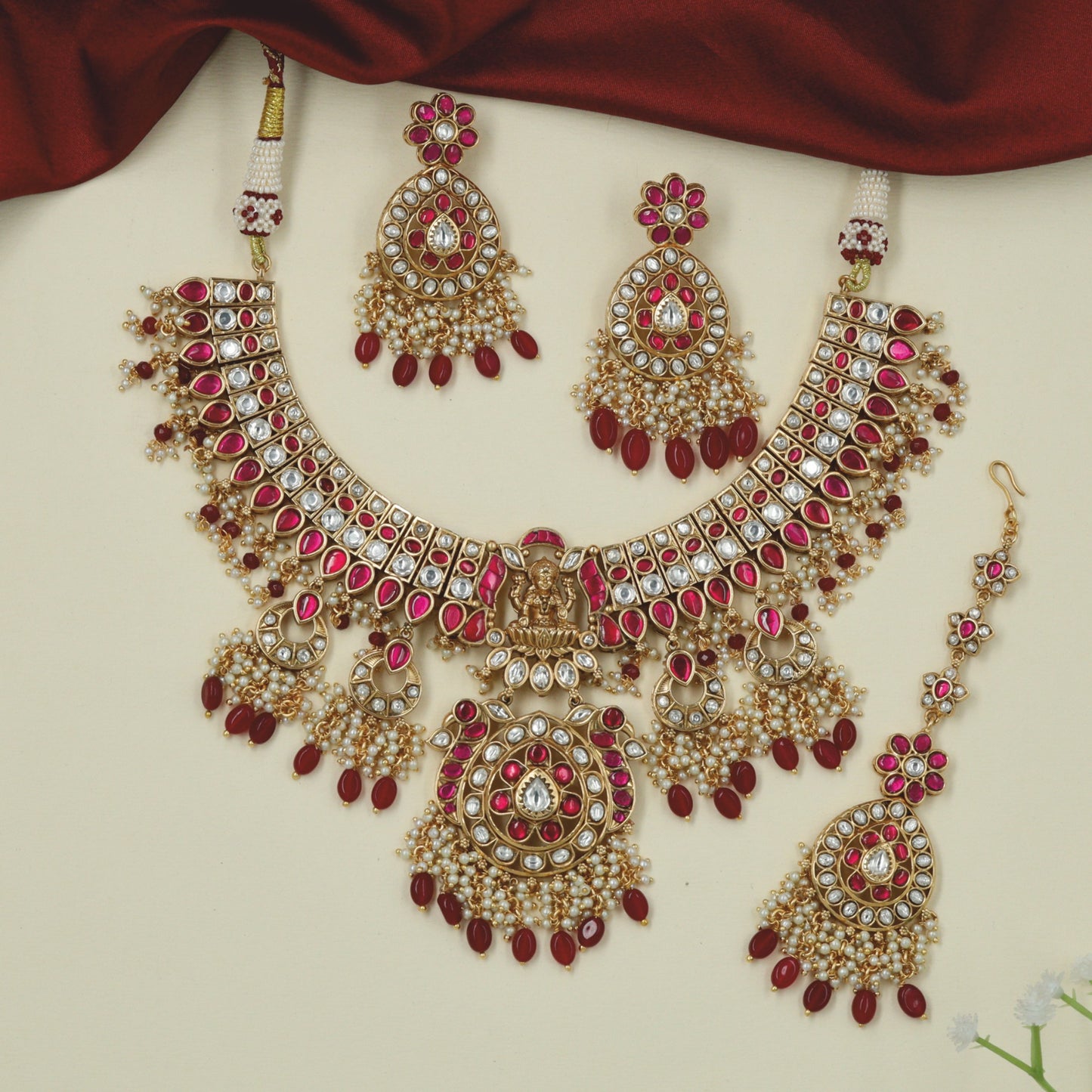 Classic royal Jadau collar necklace featuring crescent moon drops and pearl clusters