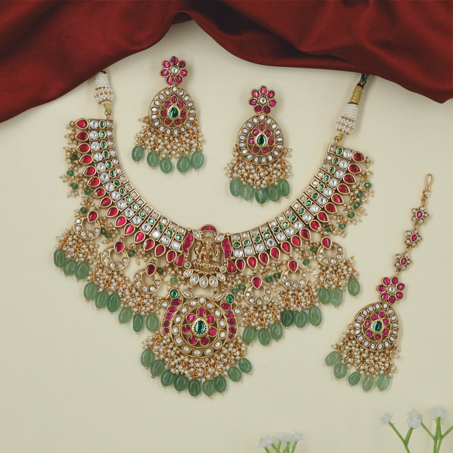 Classic royal Jadau collar necklace featuring crescent moon drops and pearl clusters