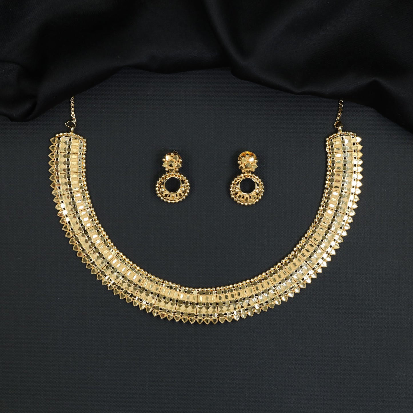 Forming Necklace with Broad Panel Work and Scalloped Edge Detailing