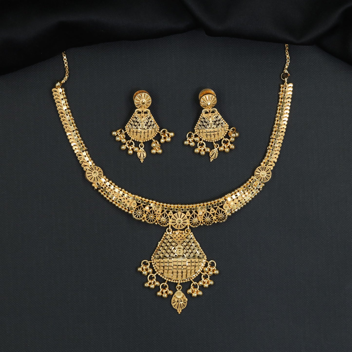 Forming Necklace Featuring Circular Sunburst Connectors and Openwork Drops