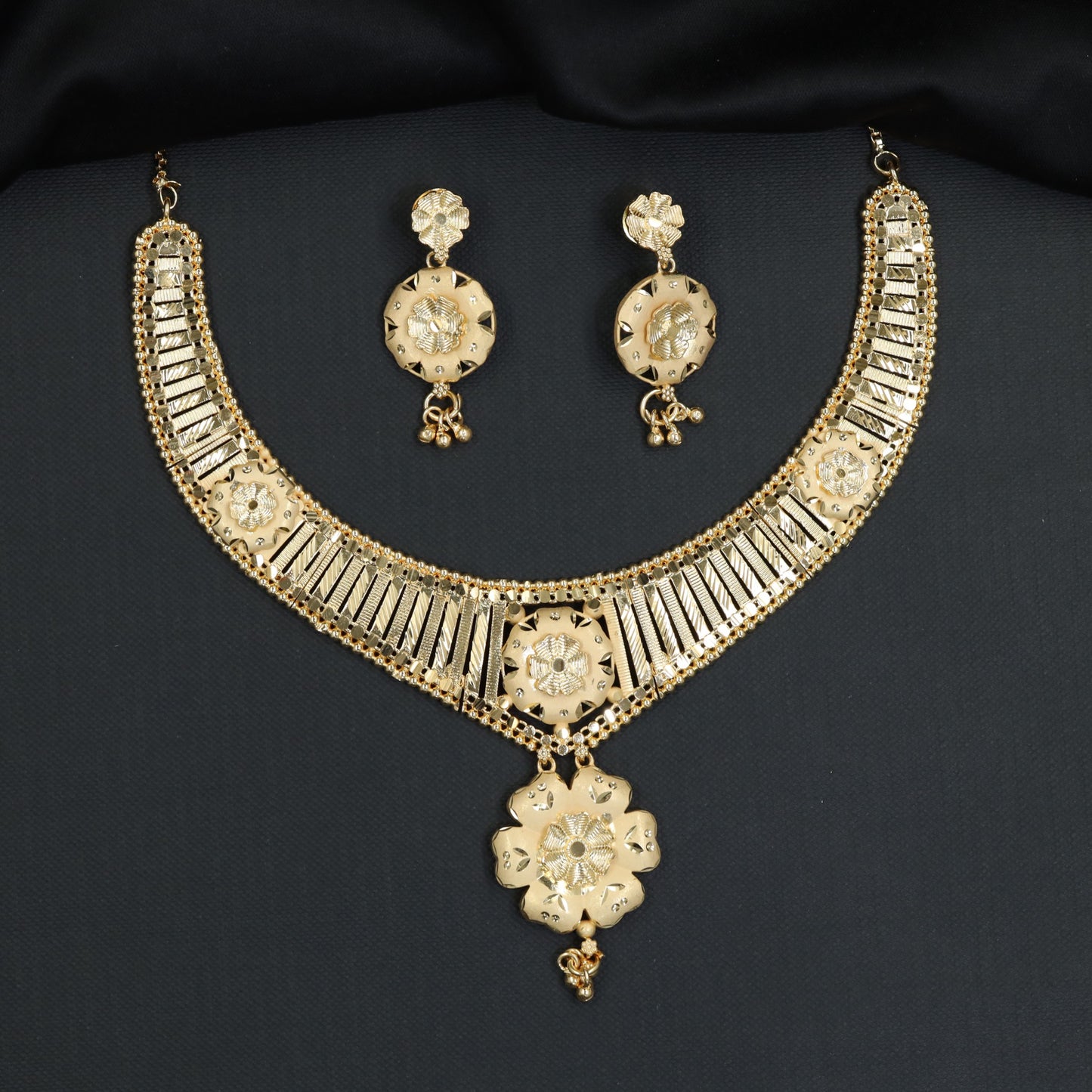 Grand festive Forming Necklace featuring textured floral medallion drops