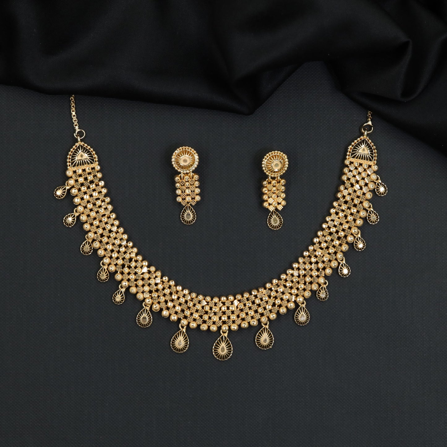 Forming Necklace with multi-row beaded mesh collar and teardrop charms