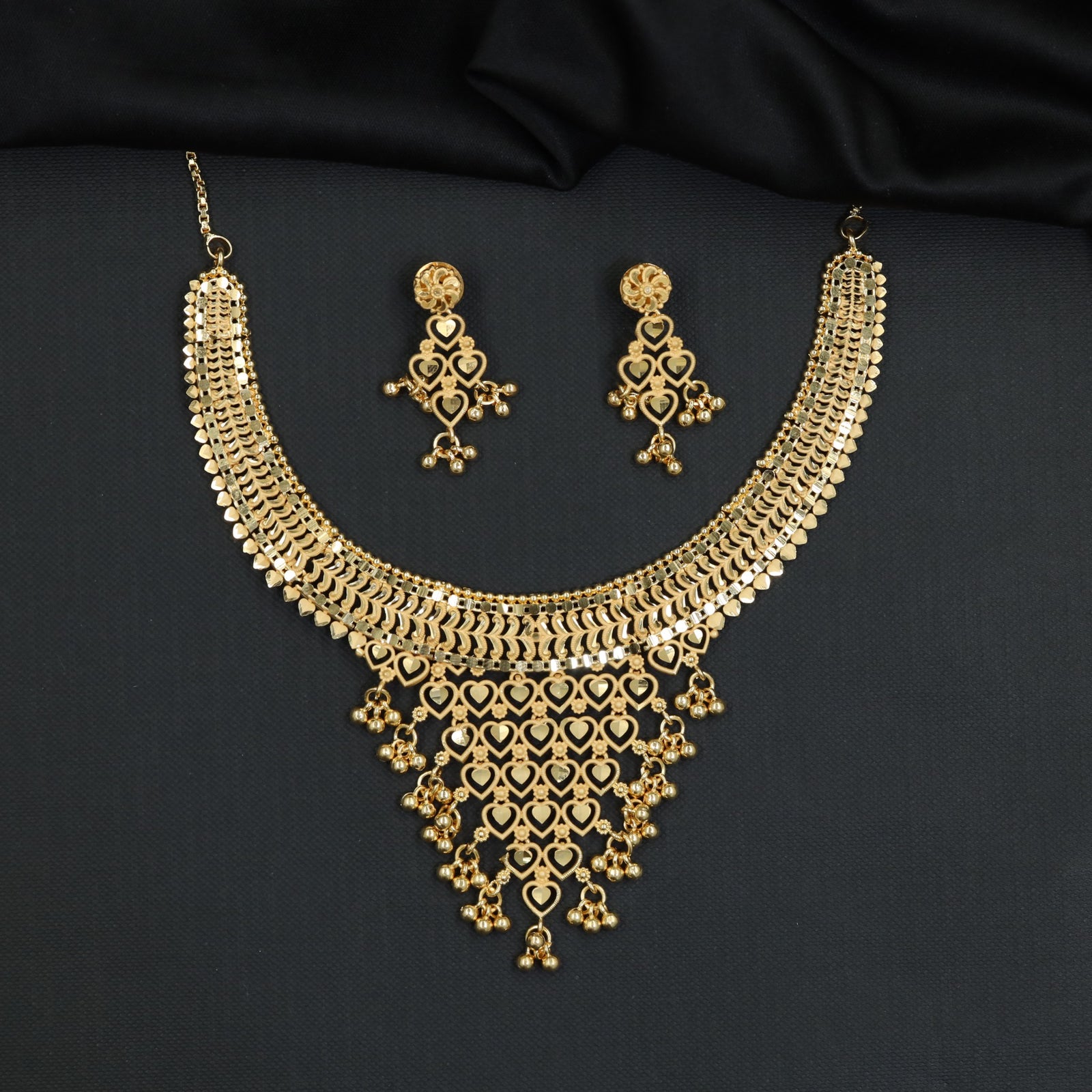 Auspicious ceremonial Forming Necklace styled with tapering heart apron