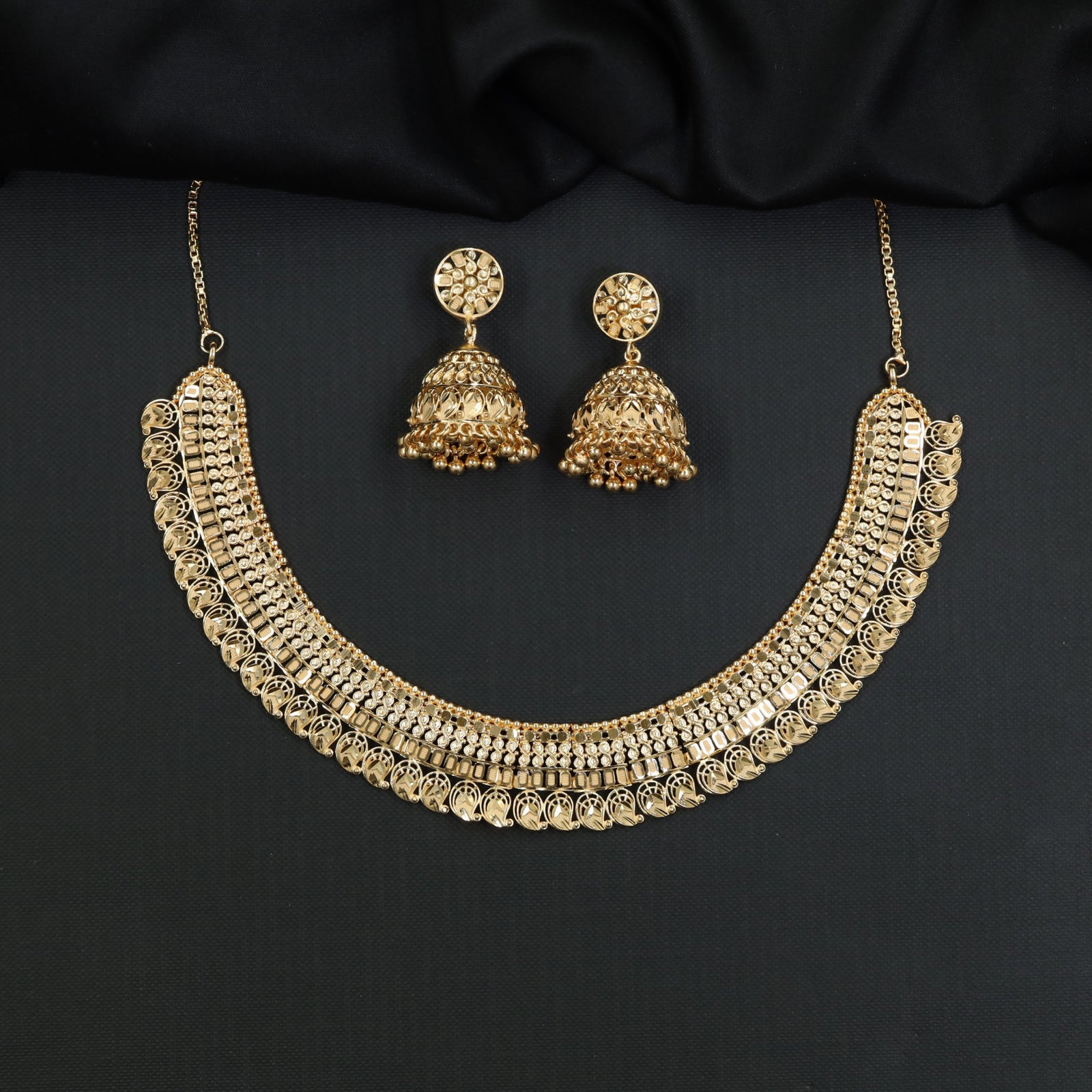 Sleek multi-layer band Forming Necklace accompanied by matching tops