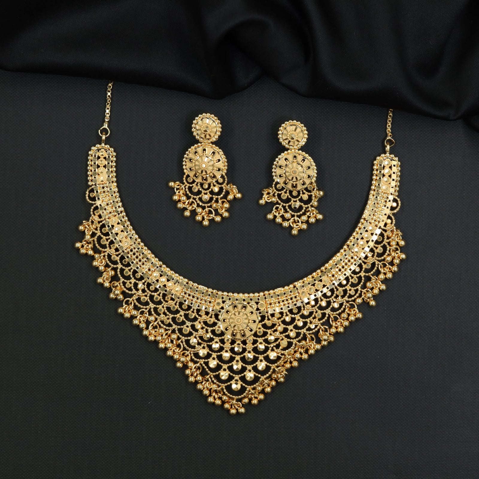 Openwork multi-row Forming Necklace with suspended ball tassel accents