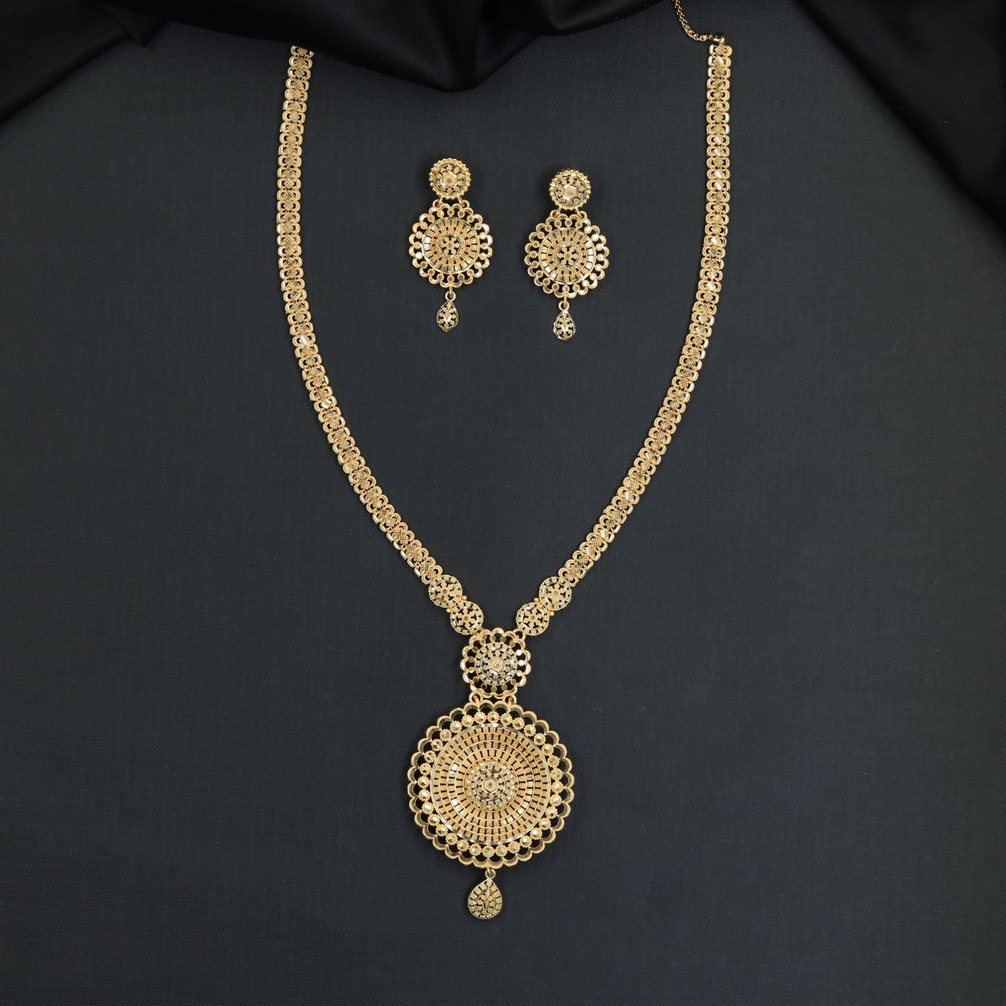 Grand celebration Forming Long Haara featuring centered floral crest