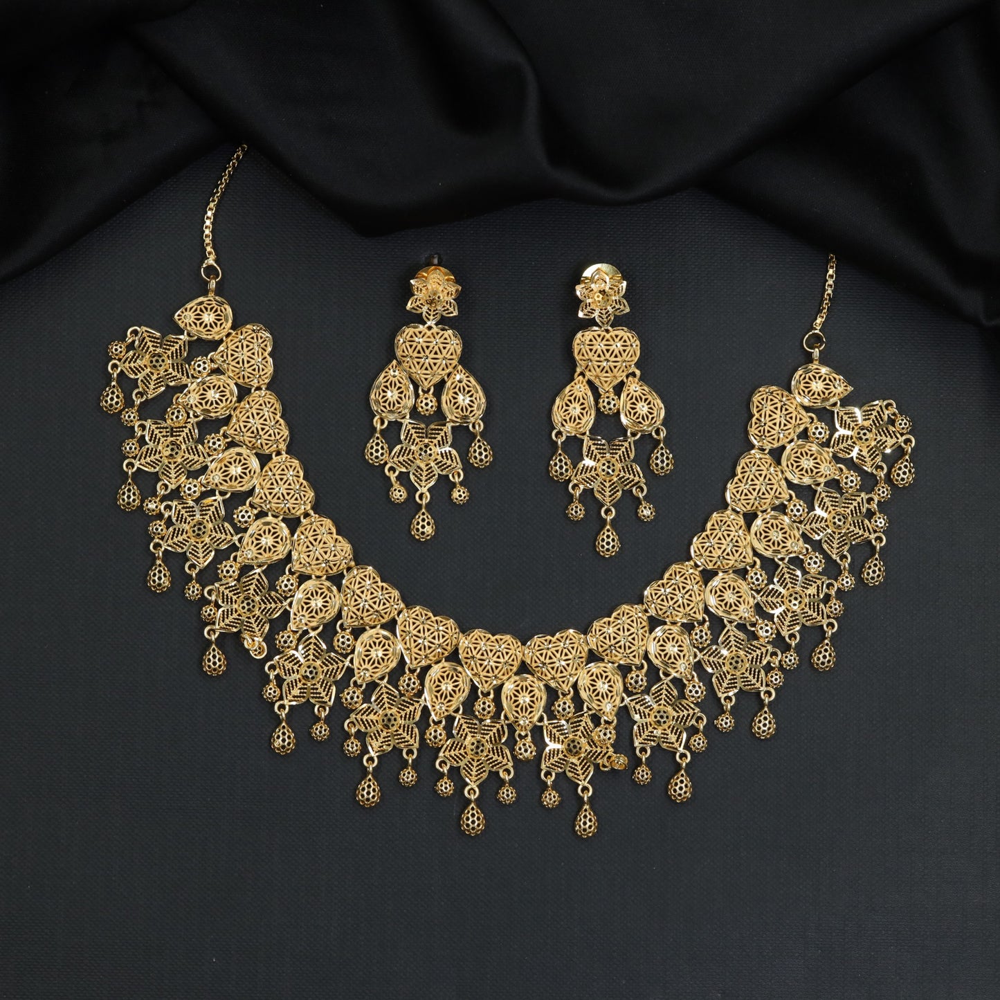 Decorative Geometric Forming Necklace with Repeating Drop Details
