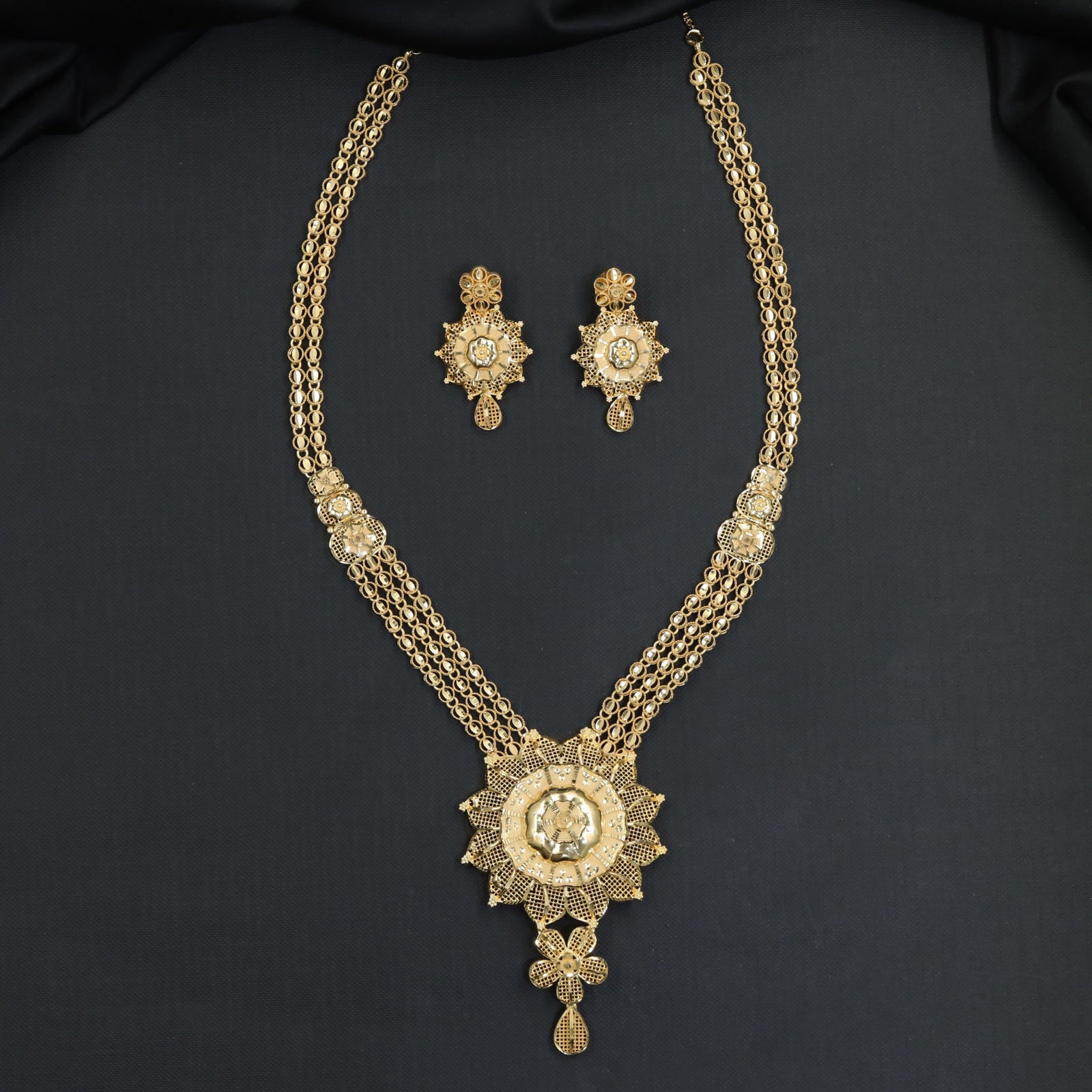 Radiant Floral Medallion with Triple Loop Strands Forming Long Haara