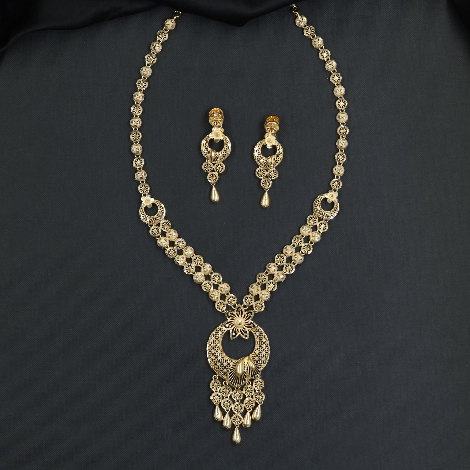 Floral Circular Linkwork with Hanging Drops Forming Long Haara