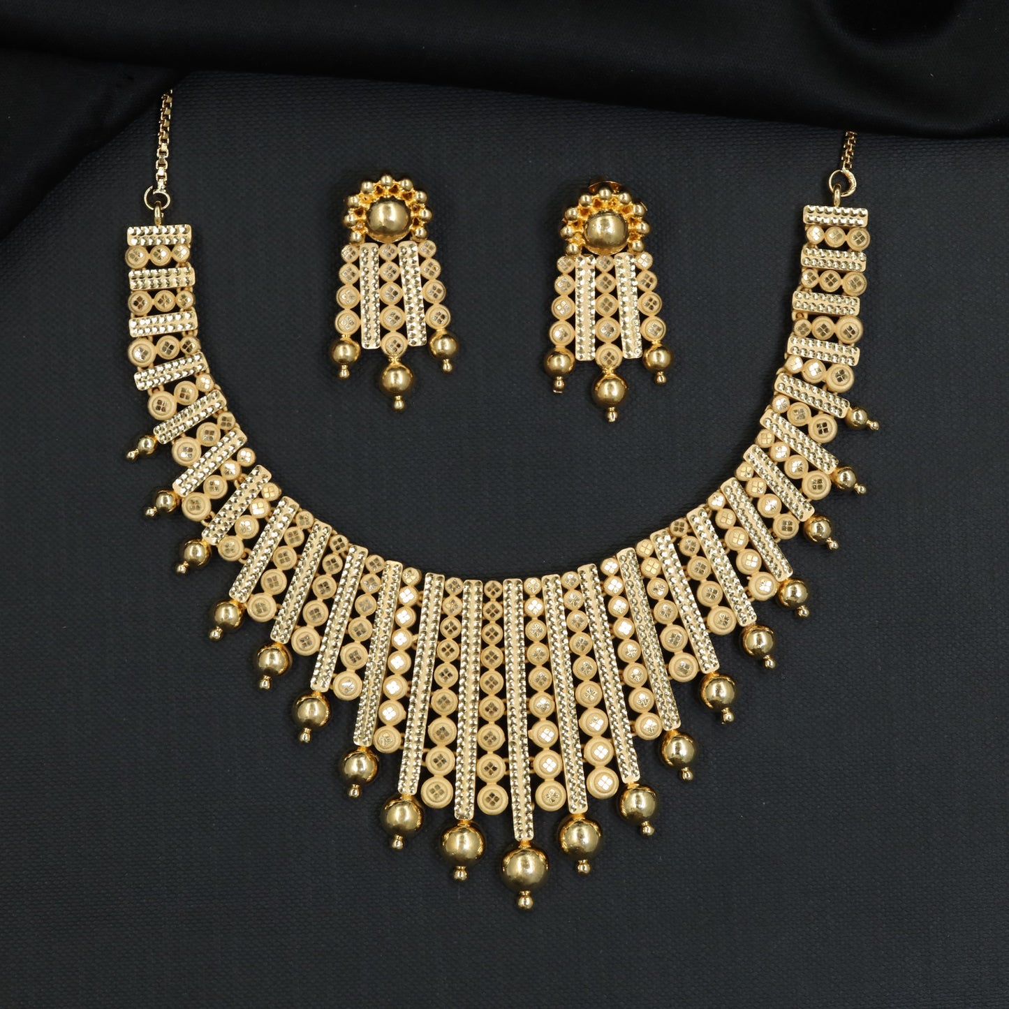 Ornamental Discwork Forming Necklace with Cascading Drops