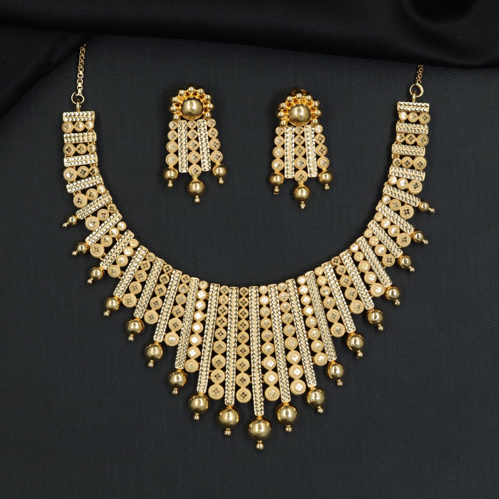 Ornamental Discwork Forming Necklace with Cascading Drops