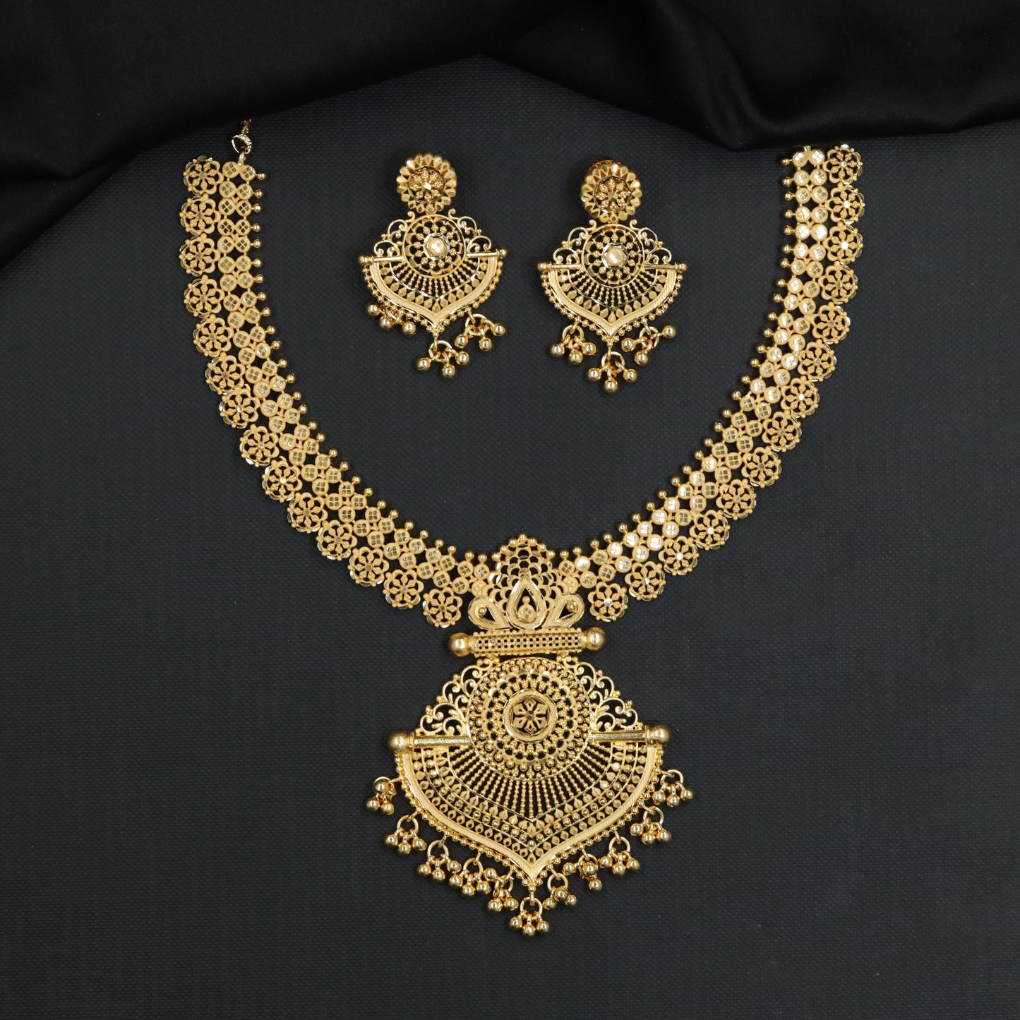 Radiant Disc Link Forming Necklace with Cascading Bead Drops