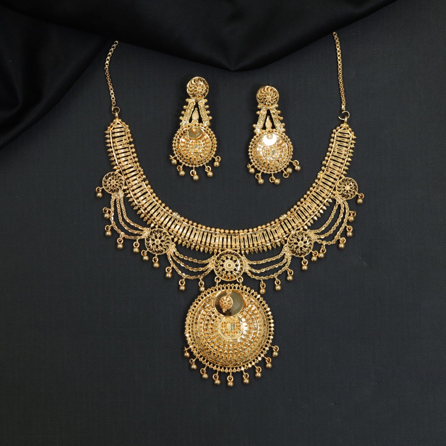 Ornate Disc Forming Necklace with Draped Chain Details