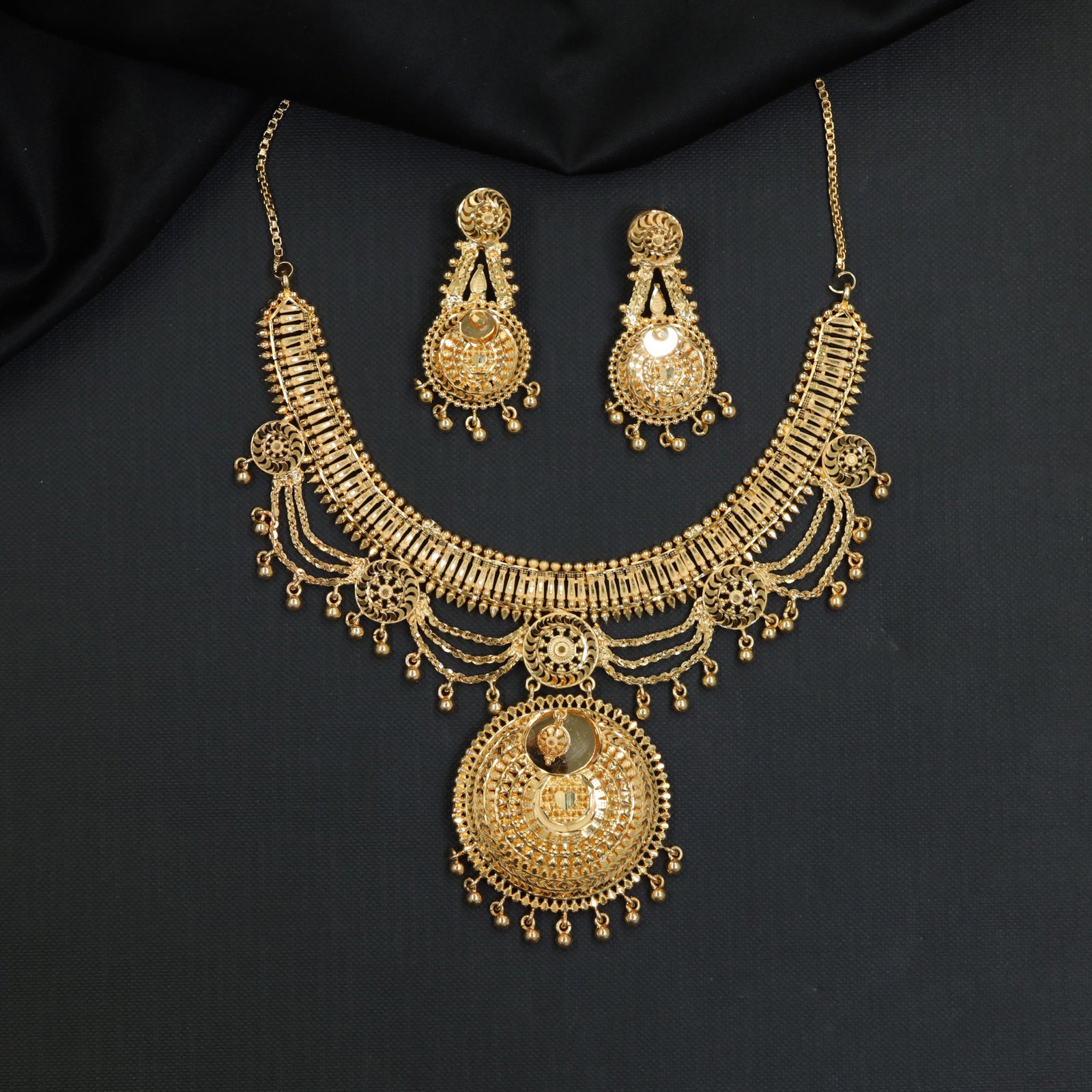 Ornate Disc Forming Necklace with Draped Chain Details